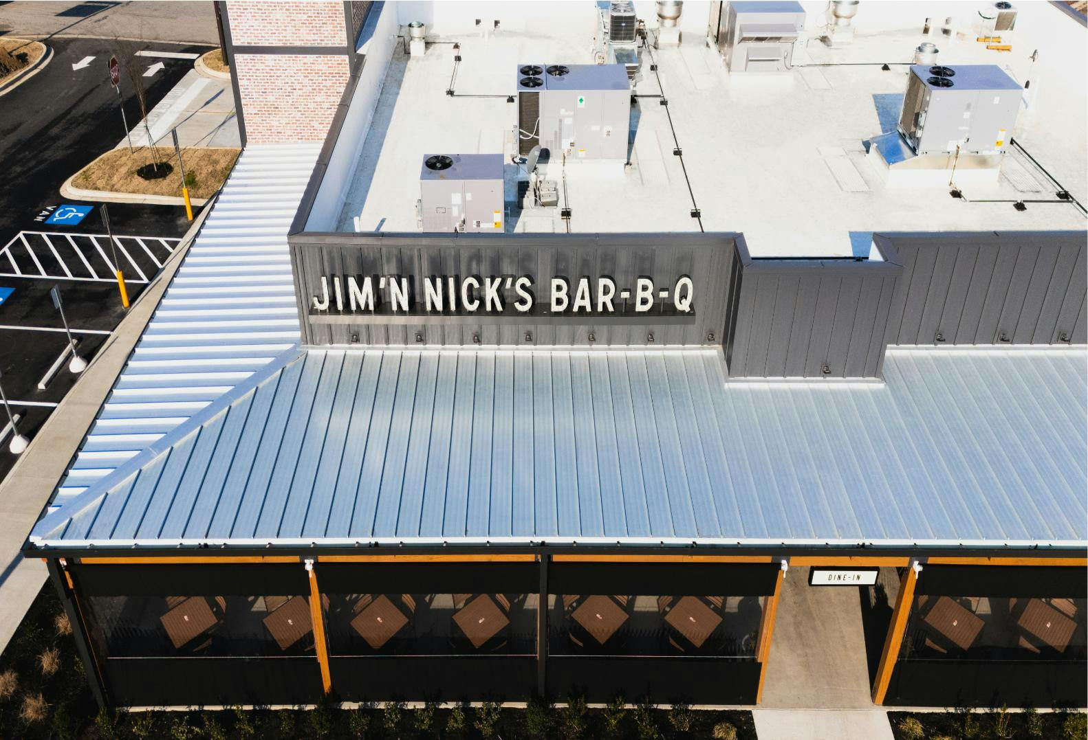 Jim 'n Nicks BBQ Restaurant Roof | Flat Roofing | Low Slope Roofing | Metal Roofing | Commercial Standing Seam Metal Roof | Commercial Roofing Solutions | Bulloch County Commercial Roofers | New Construction Commercial Roofer