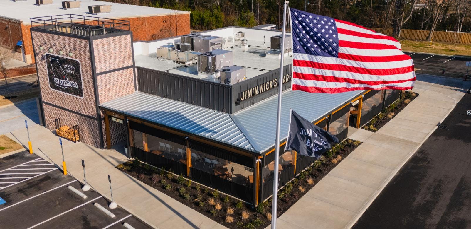 Jim 'n Nicks BBQ Restaurant Roof | Flat Roofing | Low Slope Roofing | Metal Roofing | Commercial Standing Seam Metal Roof | Commercial Roofing Solutions | Bulloch County Commercial Roofers | New Construction Commercial Roofer