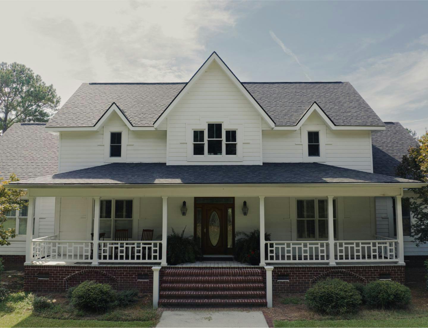Front View of Home With Architectural Asphalt Shingles | Williamsburg Gray | Candler County Residental Roofers | Residential Roofing